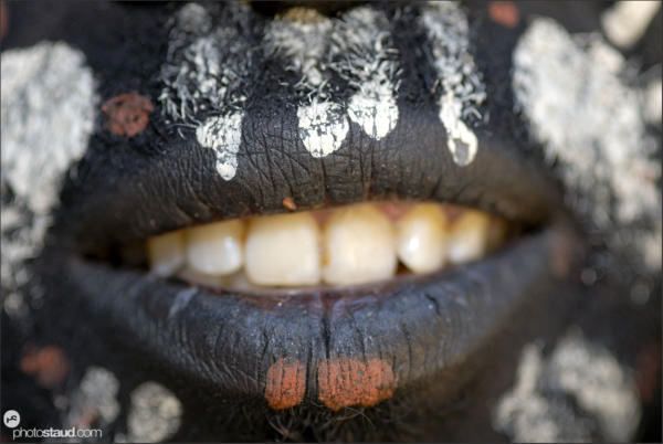 Mouth in detail - dark-painted Kikuyu tribesman, Kenya