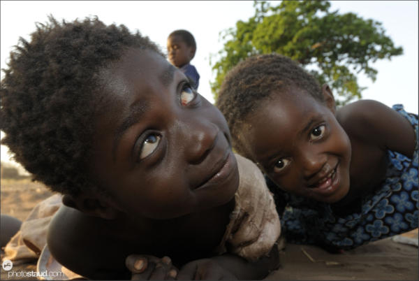 Children lying in dust, Zambia